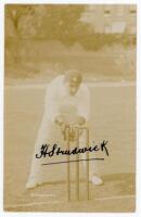 Herbert Strudwick. Surrey &amp; England 1902-1927. Excellent sepia real photograph postcard of Strudwick, full length, wearing Surrey cap, in wicket keeping pose at the wicket. The postcard nicely signed to image in black ink by Strudwick. Foster of Brigh