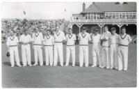 Australia tour to England 1953. Mono real photograph plain back postcard of the Australian team for the match v T.N. Pearce's XI, Scarborough 9th- 11th September 1953. The players lined up in one row wearing cricket attire, the pavilion in the background.