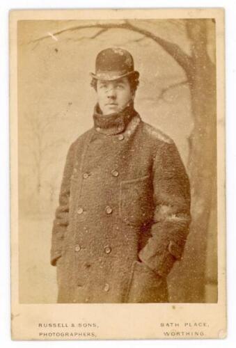 Albert James Thornton. Sussex &amp; Kent 1880-1891. Original mono cabinet card photograph of Thornton, three quarter length in thick overcoat and bowler hat. Photograph by Russell &amp; Sons, Worthing. Photographer's title to lower border. Card measures 4