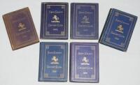 Kent County Cricket Club Annual 1925-1929. Six editions of the hardback 'blue book' including two copies of the 1928 edition. Original decorative boards. Gilt titles with gilt Kent emblem to centre. Heavy fading to the boards and spine of the 1925, one co