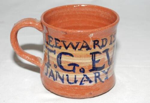 Thomas Godfrey Evans. Kent &amp; England, 1939-1967. Light brown ceramic mug/tankard presented to Evans on the M.C.C. 1953/54 tour of the West Indies. The glazed inscription to side reads 'T.G. Evans. Leeward Islands Tour. January 1954. Antigua'. The mug 