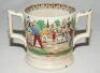 'Village cricket'. A Victorian Staffordshire loving cup, printed in black/brown with two different scenes of village cricket, with church and tents to background, floral and oak leaf rim decoration and crossed cricket bats, balls and stumps decoration to 