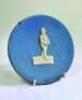 William Clarke, Nottinghamshire &amp; All England XI. Early Staffordshire style circular wall plaque with raised image of Clarke to centre in white with a light blue ground. Some gold lustre to edge. Name of 'T. Fredley' stamped to back of the plaque. The