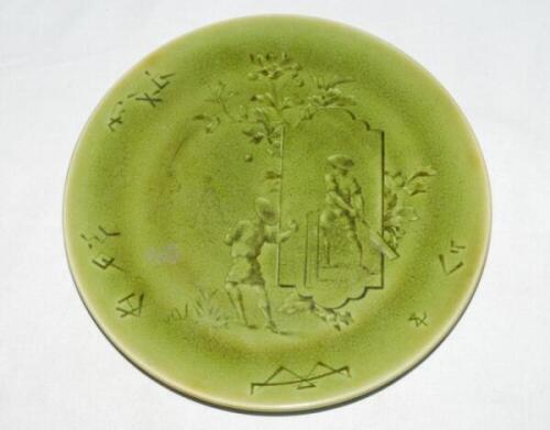 Cricket plate. A Rare Choisy Le-Roi Majolica green cricket plate depicting an Asian cricket match in the French Empire (Vietnam) with images of children (oriental) playing cricket to centre with foliage decoration and signed HB in chinese signs along the 