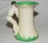 Burleigh Ware 'style' art deco ceramic cricket jug. The jug based on the 1930's original with cricket field and pavilion design to body with 'batsman' handle in white and green was produced in 2000 by Burgess, Dorling and Leigh, Burslem, near Stoke on Tre - 2