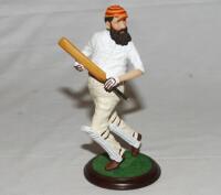 'W.G. Grace'. Large hand painted resin figure of Grace, modelled full length, wearing M.C.C. cap, mounted on wooden plinth. Approx 9&quot; tall. Fairweather Collection. G - cricket