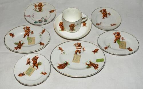 'Sporting Bears'. Three oval dishes, three small side plates, a cup and saucer and an oval pot with lid, all with image of bears playing cricket, football and roller skating. The side plates measure 4.5&quot; diameter, the oval dishes measure 5.5&quot;, 6