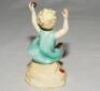 'Sunshine Days'. Modelled by F.G. Doughty. Royal Worcester figure of a girl on a beach holding a cricket ball, spade and bucket to each side of her. From the 'Worcester Children' series 1982. 3.75&quot; tall. VG - cricket - 2
