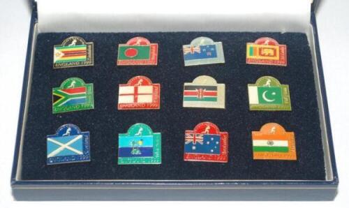 Cricket badges, mugs and glassware. Set of twelve pin badges representing flags of the participating nations, issued by the Cricketer to mark the 1999 World Cup held in England, in presentation case. Sold with a glass goblet for the England v New Zealand 