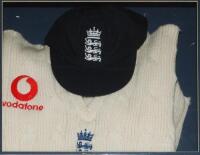 Peter Such. Essex, Leicestershire, Nottinghamshire &amp; England 1982-2001. England sweater and cap formerly the property of Peter Such presented in a display case. The cap and sweater with the England three lions and crown emblems, the sweater with 'Voda