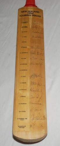 New Zealand tour to England 1994. Full size bat with printed title label and players' names to side, signed by sixteen members of the New Zealand touring party. Signatures are Rutherford (Captain), Larsen, Crowe, Davis, Fleming, Greatbatch, Hart, Hartland