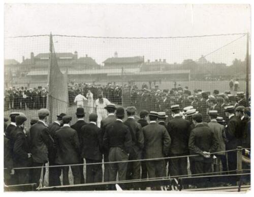 W.G. Grace 1906. Surrey v Gentlemen of England, The Oval, 16th- 18th April 1906. Two copies of original mono press photographs of Grace practising in the nets at The Oval with large crowds of spectators looking on. Pencil description annotated to verso wi