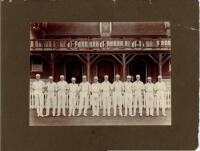Eton College 1914. Two original mono photographs of teams standing in one row wearing cricket attire, in front of the pavilion at Agar's Plough, Eton College. Both photographs annotated in pencil to lower border, 'Eaton [sic] 1914'. Each photograph measur