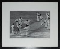 Don Bradman. The Oval 1948. Excellent large 'Getty images' mono photograph of Don Bradman at the wicket for the final time at the Oval, 5th Test 1948 in his final Test innings. England Captain Norman Yardley and the England players are doffing their caps 