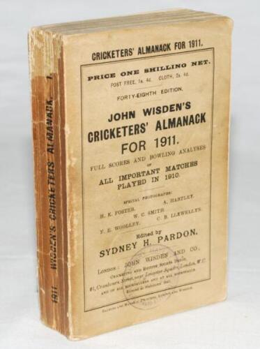 Wisden Cricketers' Almanack 1911. 48th edition. Original paper wrappers. Booksellers stamp to lower part of front wrapper, some wear with loss to the head of the spine paper otherwise in good condition. Ex 'Nowton Court' library copy with label to inside 