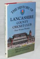 'The History of Lancashire County Cricket Club'. Peter Wynne-Thomas. Christopher Helm, Bromley 1989. Hardback with dustwrapper. Signed to the title pages and front endpaper by twenty one players, and to internal pages by seven. Signatures include John Cra