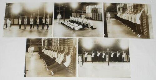'Swedish drill at Rugby School' early 1900s. Five original mono press photographs of pupils at Rugby School participating in physical drill in the gym. All images with official stamps for Illustrations Bureau, London to verso. Each 8.5"x6.5". Od