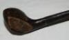 Early 'Scared Head Brassie' (fairway driver) golf club c.1895. Maker unknown. Wooden head with brass plate and metal insert to rear, hickory shaft and suede leather grip. Good original condition - golf