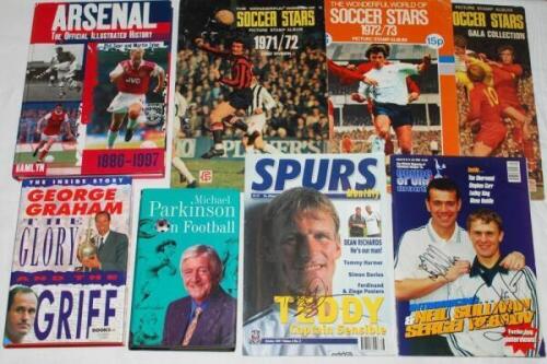 Box of football magazines, books, postcards, magazines, trade cards, stamp albums etc., some signed. Includes three signed books, 'Arsenal 1886-1997', Phil Soar &amp; Martin Tyler 1997, six signatures to front endpaper including Pat Jennings, 'The Glory a