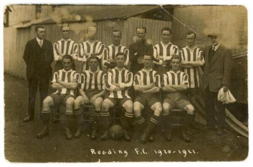 Reading F.C. 1920/21. Scarce early original mono real photograph postcard of the Reading team seated and standing in rows wearing football attire. Publisher unknown. Players' names annotated in ink to verso. Postally unused. Crease to one corner, rounding