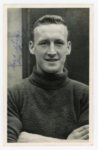 Ronald Leslie 'Ron' Baynham. Luton Town &amp; England 1951-1966. Excellent original mono real photograph plain back postcard of Baynham, head and shoulders, wearing football attire. Signed in blue ink to the photograph by Baynham. Publisher unknown. Posta