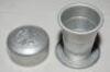 Whisky tot/cup. Portable travel telescopic aluminium cup with football scene to lid. The cup consists of three telescopic pieces that lift to form the cup. Circa 1940/50 (?). The cup measures 2.25" when fully extended. G - football - 2