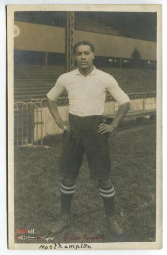 Walter Daniel John Tull. Tottenham Hotspur 1909-1911. Mono real photograph postcard of Young, full length in Spurs attire. F.W. Jones of Tottenham. The postcard has handwritten 'Northampton' to the bottom of the card. Slight silvering to card edges otherw