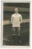 Charles Wilson. Tottenham Hotspur 1919-1922. Mono real photograph postcard of Wilson, full length, in Spurs attire in front of the main stand. W.J. Crawford of Edmonton, 'copyright 1921' to face of card. Postally unused. Very minor silvering to edges othe