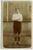 Alfred Whyman. Tottenham Hotspur 1905-1908. Sepia real photograph postcard of Whyman, full length in Spurs attire. Jones Bros of Tottenham. Some wear with very slight loss to the white border of the right hand edge otherwise in good condition - footballJo