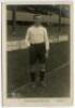 Arthur Grimsdell. Tottenham Hotspur 1912-1929. Early mono real photograph postcard of Grimsdell, full length, in Spurs attire in front of the main stand. 'W.J. Crawford' of Edmonton. Good/very good condition - footballArthur Grimsdell was signed as a scho