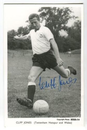 Clifford William Jones. Tottenham Hotspur 1958-1968. Mono plain backed real photograph postcard of Jones, full length in Spurs attire, about to kick the ball. Signed by Jones to image. Printed title to lower border. Good condition - football