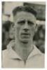 Arthur William Hitchins. Tottenham Hotspur 1934 and 1937-1939. Mono real photograph of Hitchins, head and shoulders, in Spurs shirt. Photograph by Universal Pictorial Press of London. Label to back of photograph with date 'October 1936'. 4&quot;x6&quot;. 