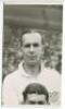 Albert Henry Gibbons. Tottenham Hotspur 1937-1938 and 1940-1946. Mono postcard size real photograph of Gibbons, head and shoulders, in Spurs shirt. Photograph by A. Wilkes &amp; Son of West Bromwich, dated '1938'. Good condition. A rarer photograph - foot