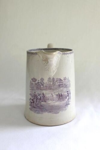Cricket, Association [football] and Rugby. A large, attractive and early Staffordshire jug printed in blue with three interesting vignettes, one of a cricket match in progress, with players, umpires, a large marquee and tent, spectators and woodlands in b