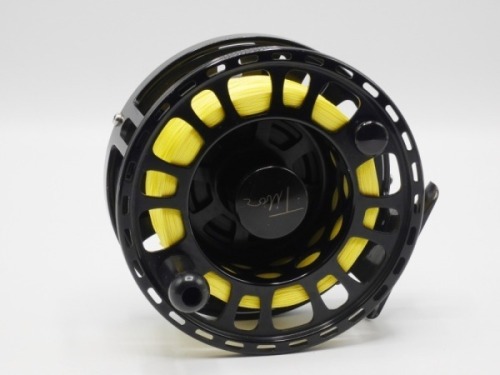A Tibor Signature Series 11-12 saltwater fly reel, left hand wind black anodised model with counter-balanced handle, large arbour drum and rear milled spindle mounted tension adjuster, light use only, in original neoprene pouch (see illustration)