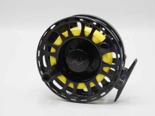A Tibor Signature Series 9-10 saltwater fly reel, left hand wind black anodised model with counter-balanced handle, large arbour drum and rear milled spindle mounted tension adjuster, light use only, in original neoprene pouch and card box