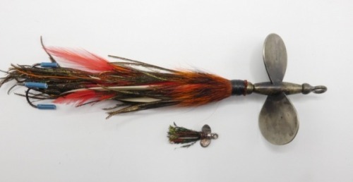 A scarce Hardy Improved Halcyon Spinner 6" bait, large nickel silver twin vane head on central spindle with loop eye and fixed rear treble hook, peacock herl and cock feather dressing, vanes stamped makers name and a similar 1" example, in oak box, circa 