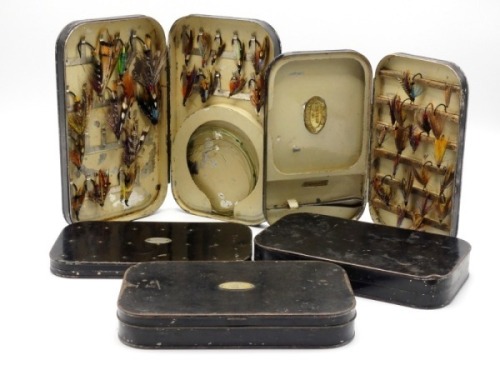 A Malloch black japanned salmon fly box, cream painted interior fitted spring clips and circular cast compartment, holding a selection of gut and steel eyed fully dressed salmon flies, a Farlow japanned fly box, cork bars and cast compartment, a Hardy jap