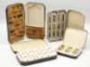 A Hardy Girodon Pralon black japanned trout dry fly box, lid with painted detail “Chalkstream flies tied by Alfred Lunn", cream painted interior fitted fifteen lidded compartments, ivorine index plate and tweezer recess, holding a selection of forty six d