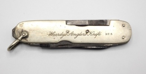 A scarce Hardy No.4 Angler’s Knife, fitted eight G. Butler, Sheffield steel tools, nickel silver side plates stamped model and address details, hinged shackle, small chip to blade, 1930’s