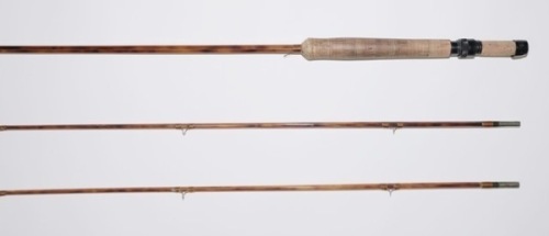 A scarce Paul H. Young “Parabolic 17" 2 piece (2 tips) cane trout fly rod, 8’6", 5.45ozs., flame finished cane, tan silk wraps, black anodised screw grip reel fitting, suction joints, full open bridge butt ring and snake eyes throughout, serial no. 4017,