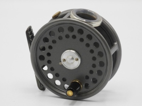 A good Hardy St George 3" trout fly reel, ebonite handle, ribbed brass foot, two screw rum latch, white agate line guide (no cracks), milled rim tension screw and Mk.II check mechanism, unused condition, in zip case, 1960’s (see illustration)