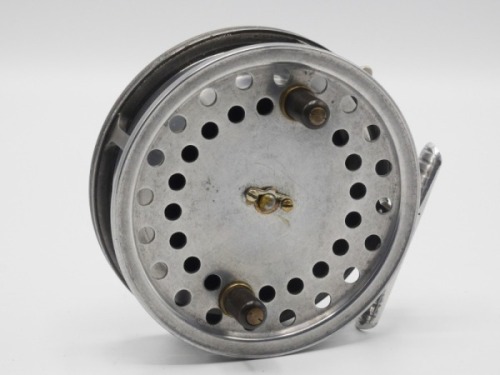 A Hardy Eureka 4" centre pin reel, shallow cored drum with twin ebonite handles and nickel silver telephone drum latch, ribbed alloy foot, rim mounted optional check lever and bar spring check mechanism, rear plate stamped make and model details, circa 1