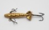 A James Ogden 1 1/2" Patent Spinner minnow bait, the gilt metal fish shaped lure with spiral fluted body, three rear spinning vanes, stamped makers details, two side mounted and one rear mounted treble hook, circa 1900 and a collection of twelve spoon an