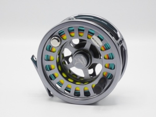 A Vossler S3 salmon fly reel and spare spool, graphite anodised large arbour reel with counter-balanced handle, milled spool locking nut and rear spindle mounted tension adjuster, light use, in original cloth pouches and a Bruce & Walker “Merlin Stream K