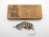 A scarce Hardy 11/0 Lady Amhurst pattern tarpon fly, silver painted forged steel hook and fly head, silver tinsel ribbed body and fully dressed wing, contained in a Hardy brown metal edged card box, advertised in the Hardy 1934 Anglers Guide in various pa