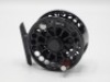A fine Charlton 8350c configurable trout fly reel, left hand wind black anodised model with #1/2 weight spool, counter-balanced rosewood handle, push button spool release, ventilated drum and cage, rear spindle mounted tension adjuster, new/unused conditi
