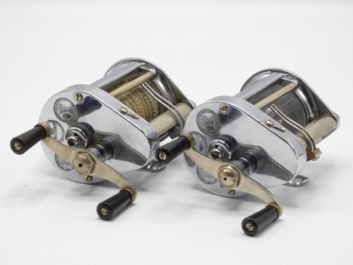 A Hardy Elarex bait casting reel, chromed casing, twin reverse tapered ebonite handles, perspex splash back cover, level line mechanism and a similar model, without perspex cover, both 1950’s and in rexine cases with some accessories (2)
