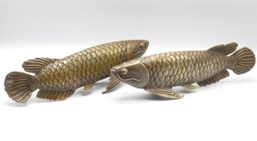 A pair of oriental brass Arapaima naturalistically modelled in swimming pose, 11 1/2" long (2)