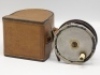 A Hardy block leather trout reel case, lid ink inscribed F.M. Halford 1905, to take a 3 3/8" reel, red velvet lined interior and leather locking strap, one side panel with applied paper label ink inscribed “Cecil" (F.M.H.’s grandson) and holding an un-n - 2